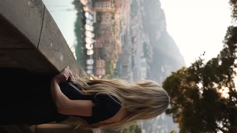 beautiful woman on vacation holiday in monaco at port de fontvielle, cinematic vertical