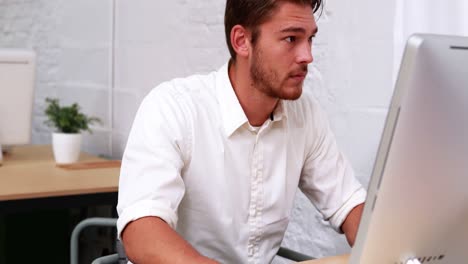 casual businessman working at his desk