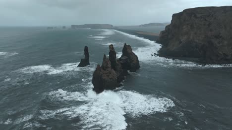reynisdrangar seastacks in iceland at the black beach close to vik