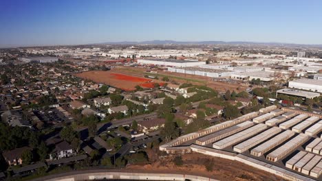 Reverse-aerial-wide-shot-of-an-industrial-community-in-the-South-Bay