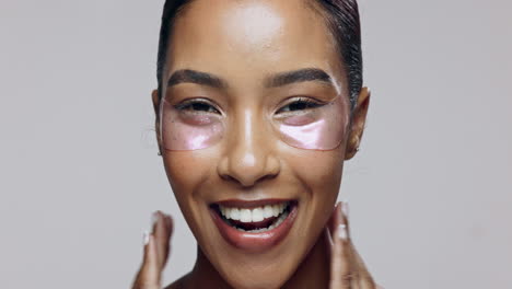 woman applying eye patches