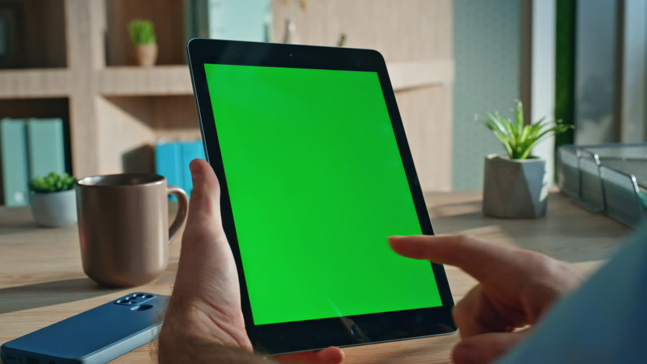 Corporate professional touching mockup tablet working at office close up.