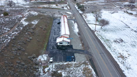 circling an old, wintery, snowy motel in tehachapi, ca