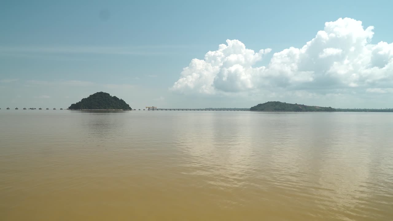 Batang Lupar Sarawak River Ferry Ride View During Summer And Under Construction Longest Bridge Conecting From each side,Sarawak,Borneo.
