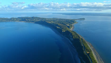 aerial drone flyover lemuy island natural land channel bonding detif, chile, chiloe 4k