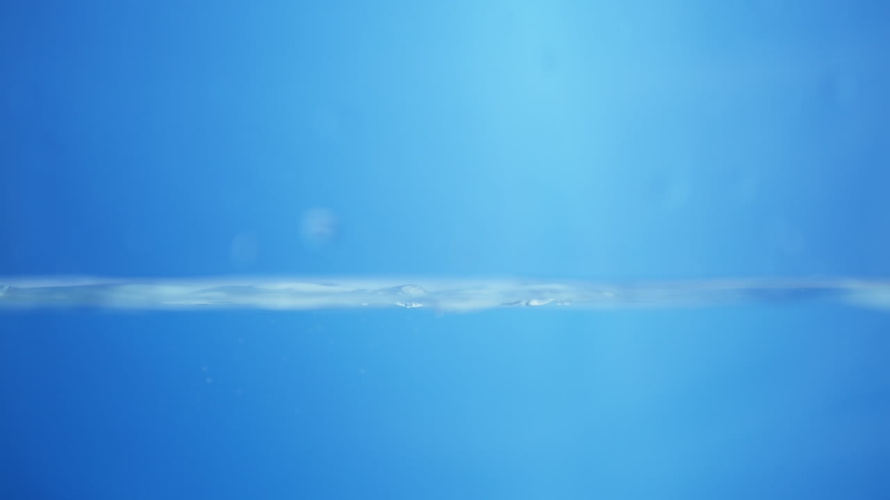 Water Drop Splash on Blue Background