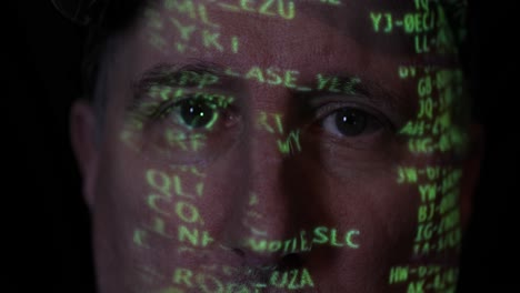 man with digital coding projected on his face