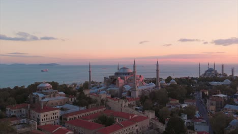 beautiful sunset over hagia sophia in fatih district of istanbul, turkey - aerial drone