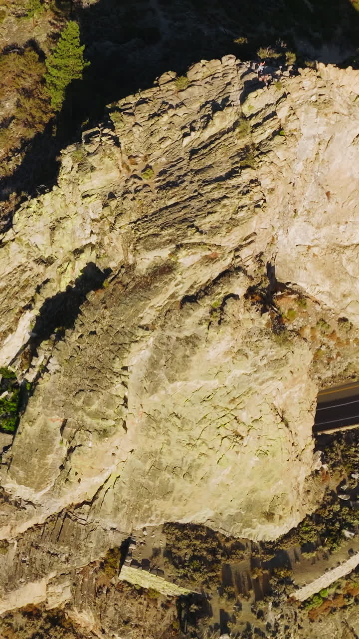 Aerial Cave Rock tunnel along the eastern shore of Lake Tahoe. Beautiful rocky outdoor scnery. Vertical video