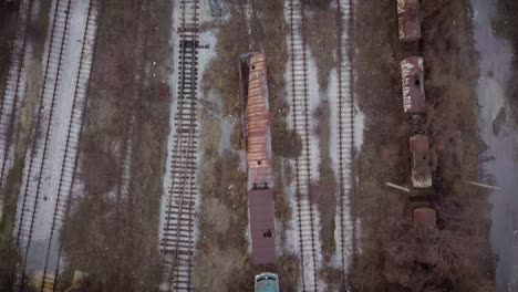 aerial view of abandoned railway with rusty train cars