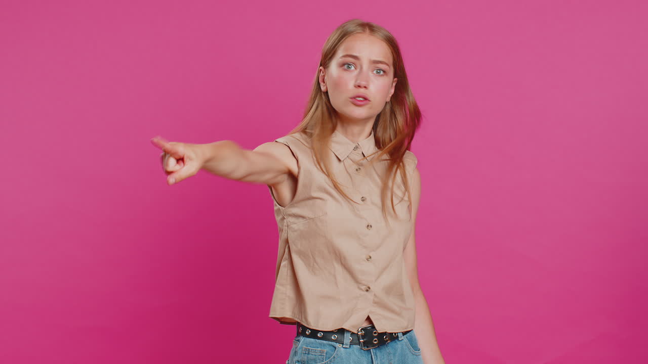Caucasian woman pointing finger away asking to leave her alone strict boss firing conflict quarrel