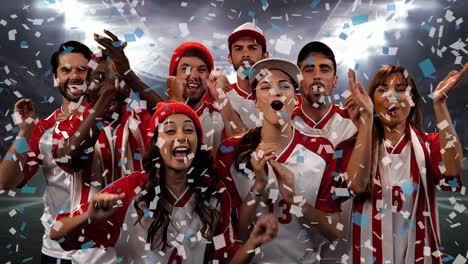 group of fans cheering for their team with confetti