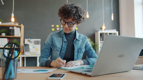 woman working at laptop in office