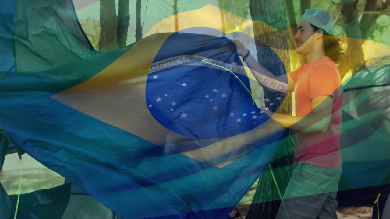 Animação da bandeira brasileira sobre pessoa montando barraca na floresta
