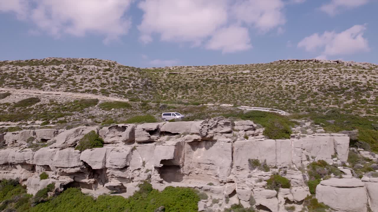 Drone 4K. Car follow in Crete's road. Greece