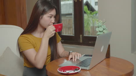 young asian woman using smart phone at coffee shop
