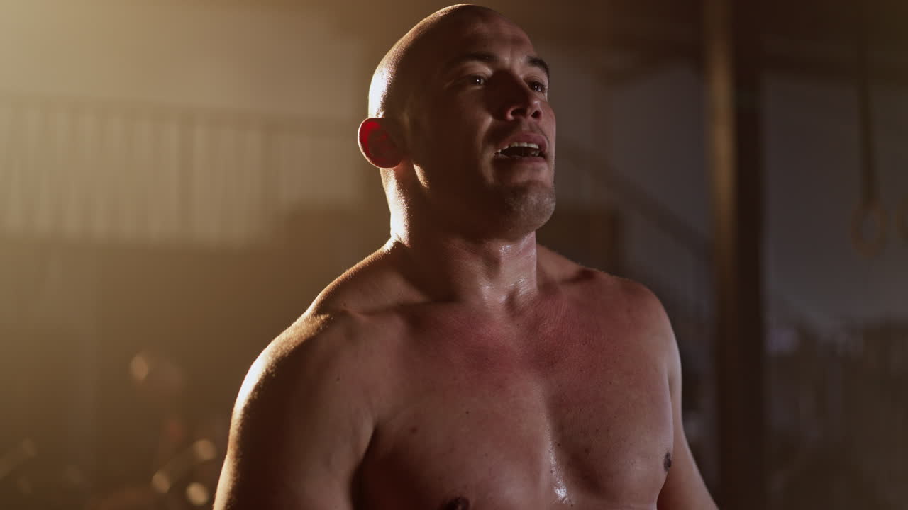 Shirtless Man Exercising at the Gym