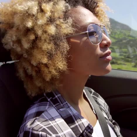 a young black woman driving