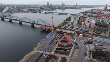 urban development, new railway bridge rises alongside historical landmarks, riga