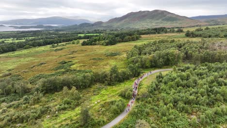 Aerial-View-of-Hillwalkers-Walking-Along-Path-Towards-Conic-Hill