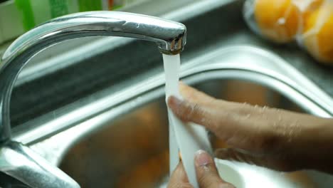 washing dishes in the kitchen sink