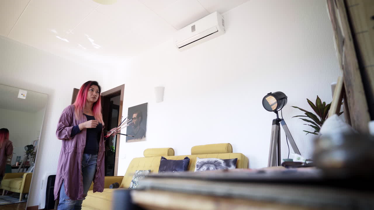 South Korean creative arts artist checking her work for changes