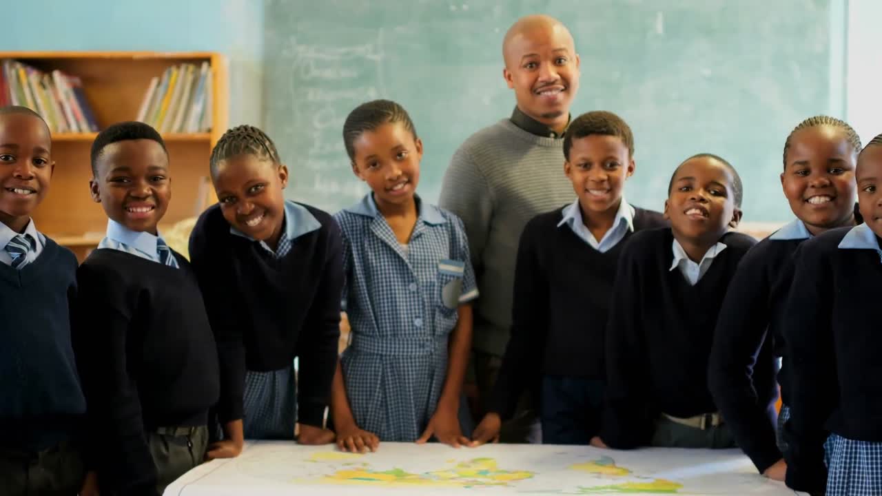 Schoolkids and teacher standing in the classroom at school 4k