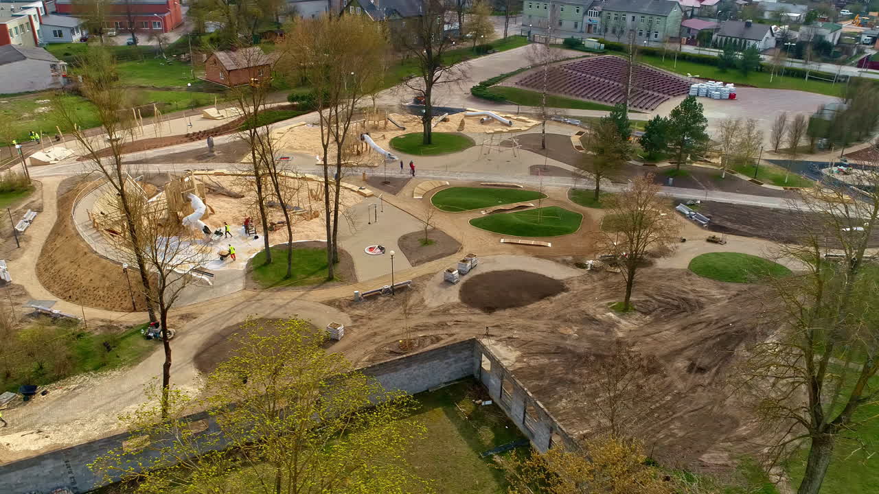 Workers Working At The Children's Playground In Uzvaras Parks Under Construction In Jelgava, Latvia