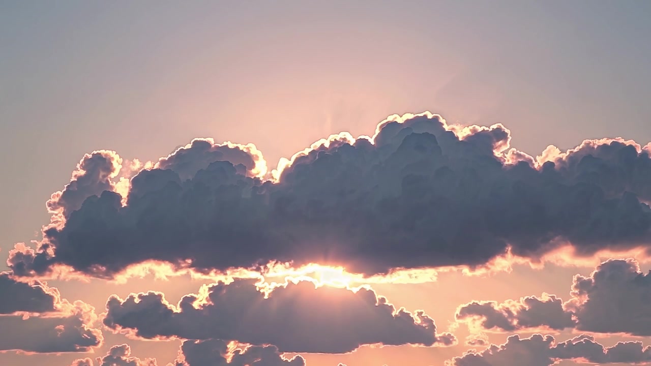 Sunlight Peeking Through Clouds During Sunset