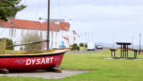 red boat near dock in dysart, fife