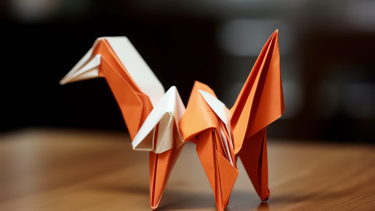 Orange and white origami giraffe positioned on a wooden table against a dark background, embodying creativity, artistic expression, and the rich traditions of Japanese culture