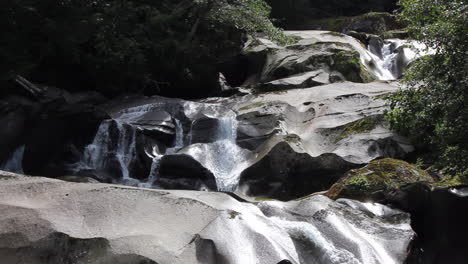 multi layered smooth rock waterfall has evidence of eons of erosion