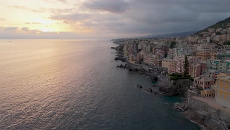 genoa nervi's coastline at sunset with calm sea and colorful buildings, aerial view