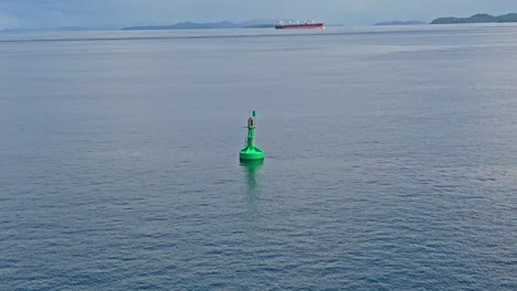 aerial point of interest of marine navigation buoy in the surigao strait, philippines