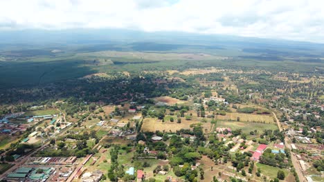 aerial drone view open air market in the loitokitok town, kenya and mount kilimanjaro- rural village of kenya