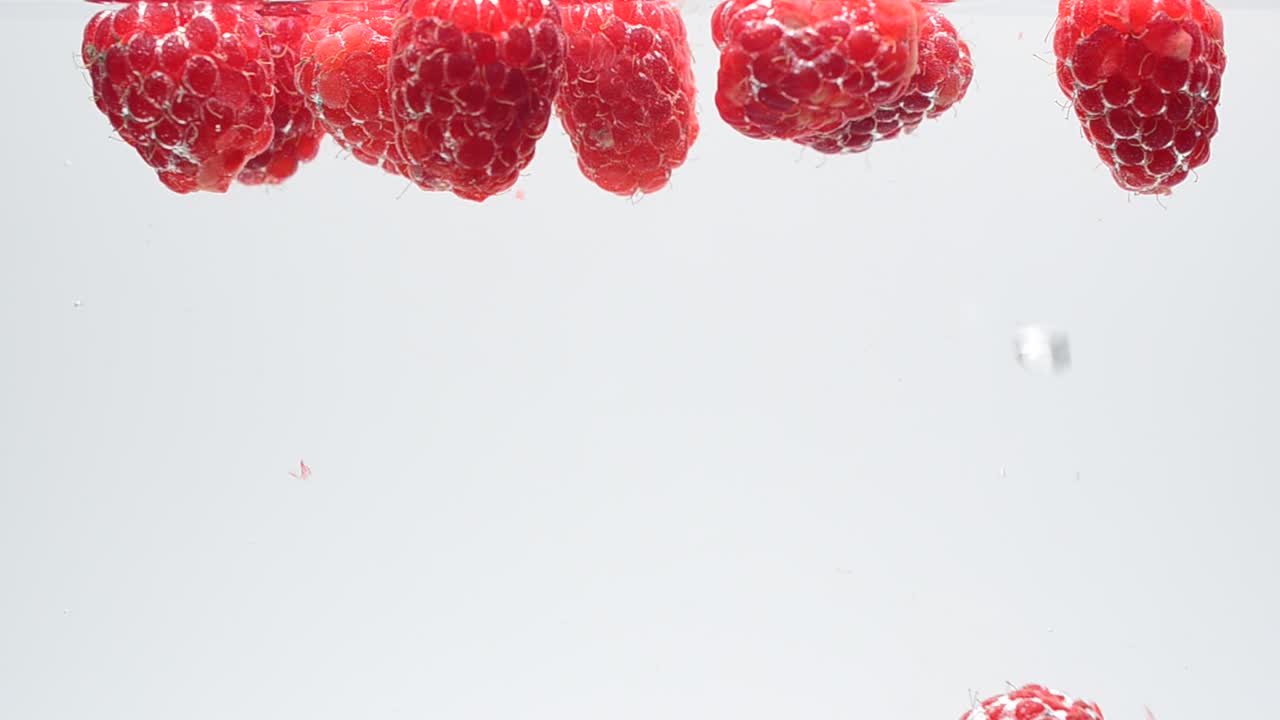 Raspberry on a white background. Shooting on a white background