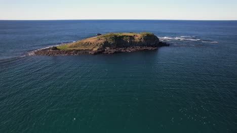 flying towards cook island in nsw, australia - drone shot