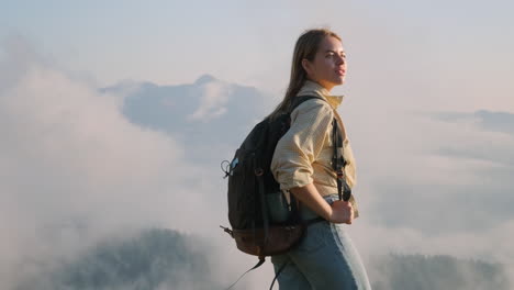 woman hiking in misty mountains