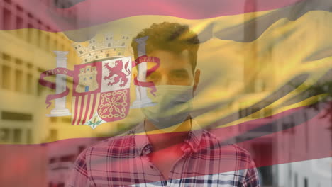 animation of flag of spain over man wearing face mask