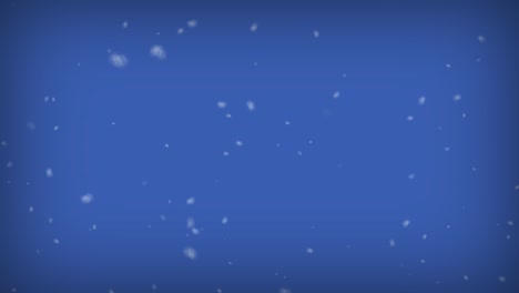 los copos de nieve que caen sobre un fondo azul, la nieve de invierno. 4k
