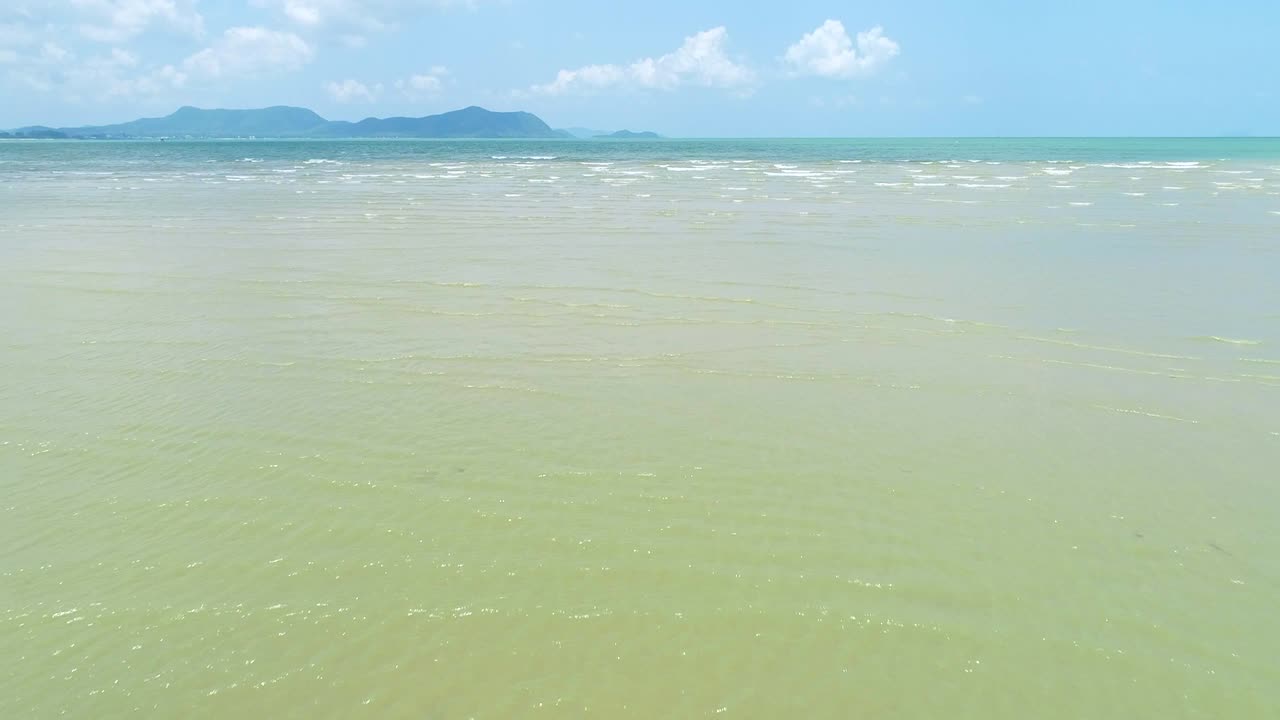 4K woman walk on the beach, foot print on sand texture and coconut tree on the beach photo by drone.