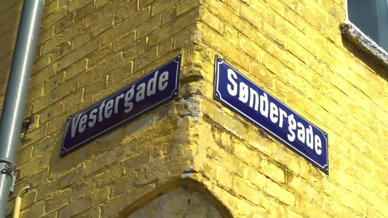 Street signs on a corner of Vestergade and S&oslash;ndergade in urban Denmark