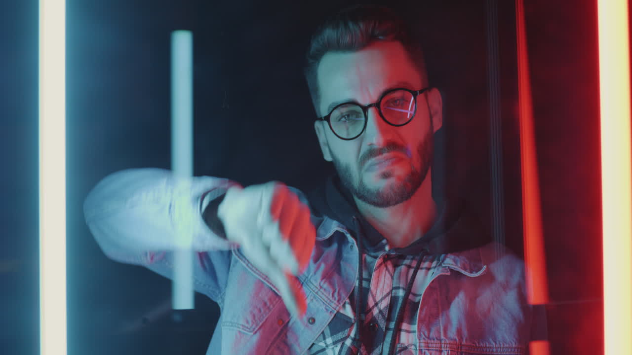 Man expressing disapproval in neon light