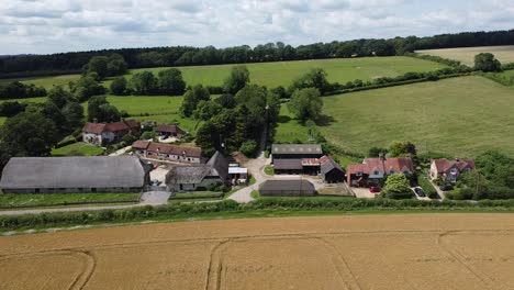 a high angle drone shot of a very small english village in the south of england, this video was shot at sunrise on a bright day and was recorded on the dji mavic 2 pro at fhd 1080p