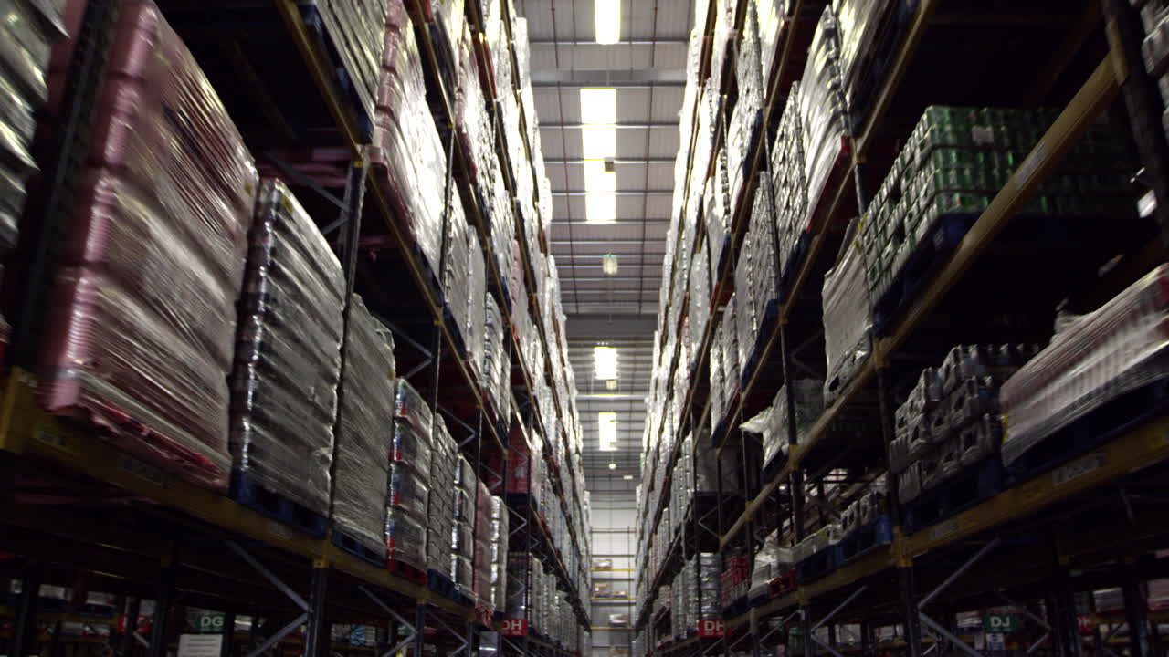 Moving along an aisle in a storage warehouse, shot on R3D