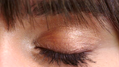 detail of woman wearing mascara makeup