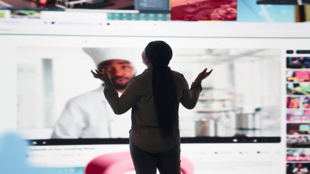 Woman embraces abundance of video content displayed on digital wall dashboard