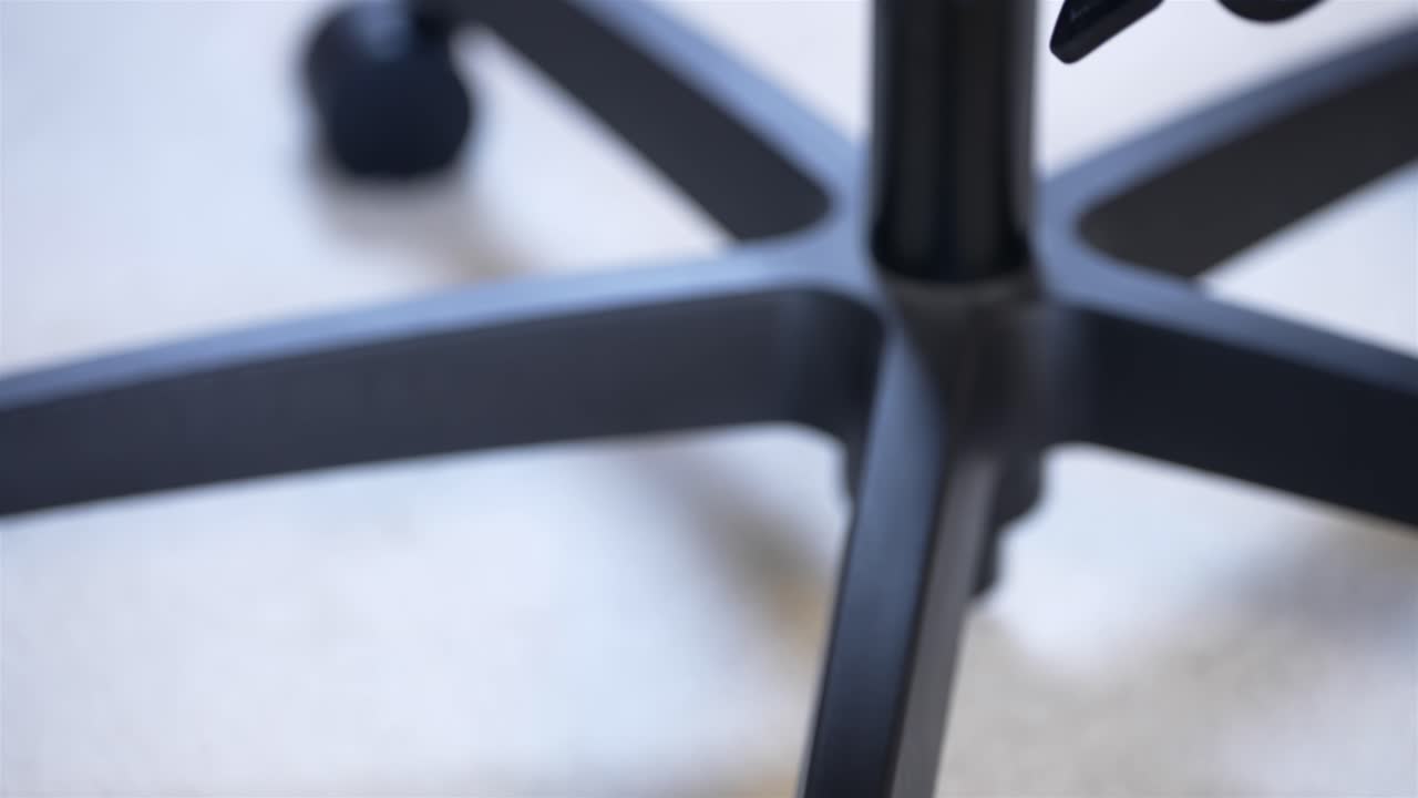 Close up of modern office chair detail, black furniture