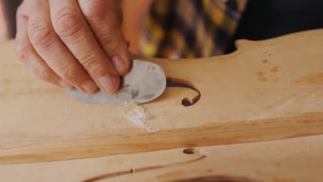 female luthier at work in her workshop