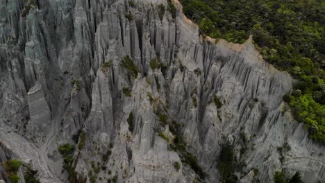 Eroded-rock-pillars,-spectacular-nature-wonder,-aerial-look-up